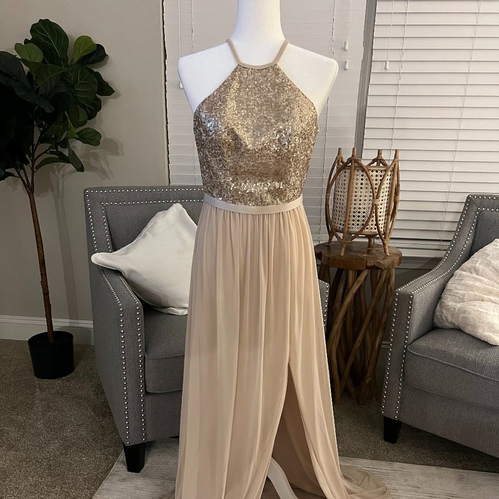 NEW GOLD a sequined, high-neck halter, open back, and mesh skirt create a glam